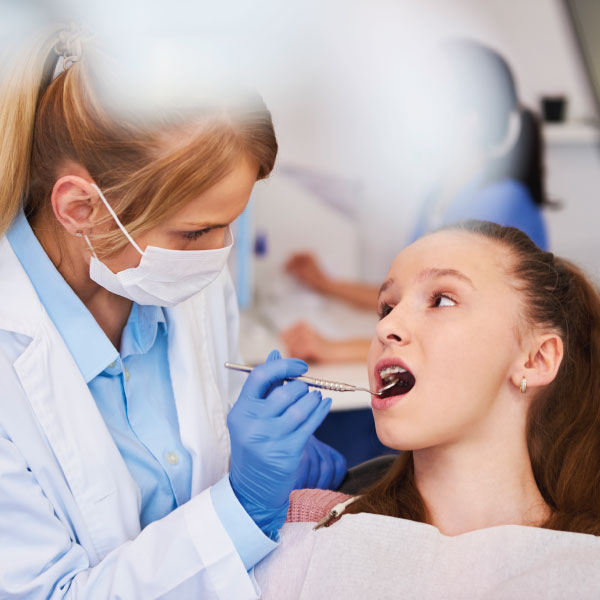 Teenage Dental Patient Receiving Care in Raleigh, NC