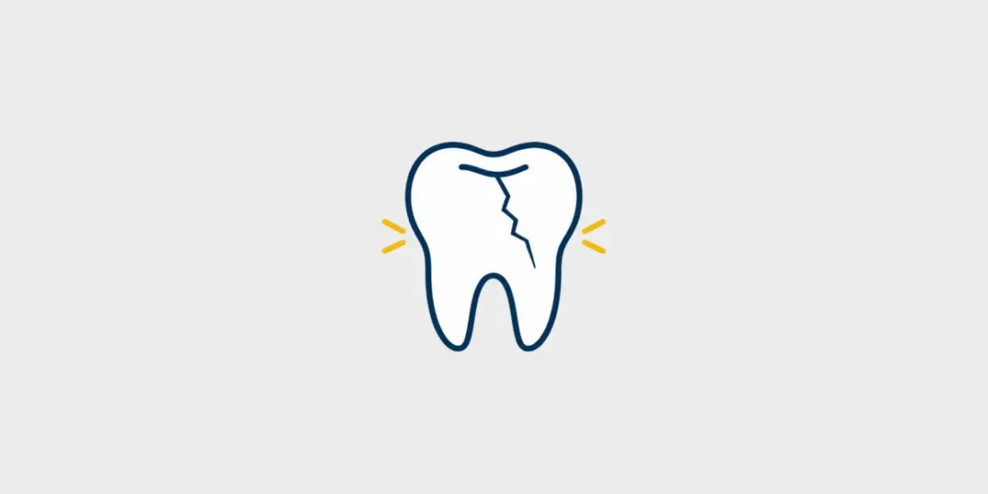 Navy and gold line icon of a cracked tooth with small sensitivity marks on a light gray background.