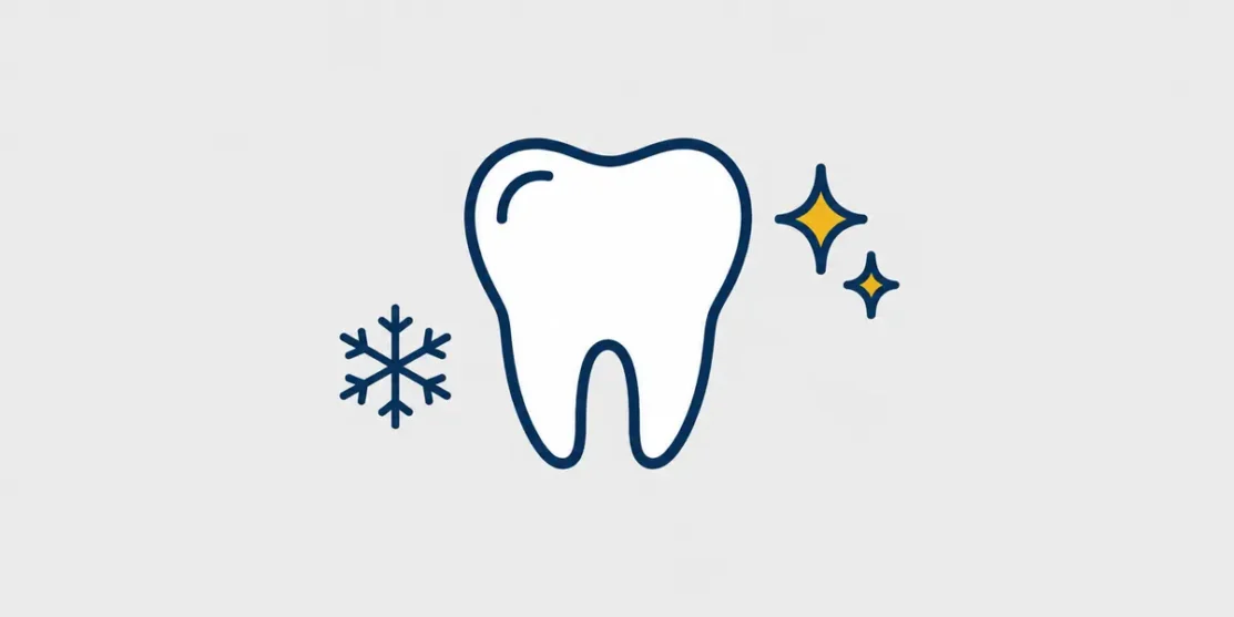 Navy and gold line icon of a healthy tooth with whitening sparkles and a snowflake on a light gray background